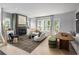 Inviting living room with a fireplace, comfortable seating, and ample natural light at 1432 Wicker Wood Se Pl # 9, Smyrna, GA 30080
