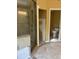 Bathroom with glass shower, tile surround and travertine floors, undergoing renovation at 2256 Mack Rd, Douglasville, GA 30135