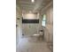 Bathroom featuring new walk-in shower with glass door and tile surround with dark accent row at 2256 Mack Rd, Douglasville, GA 30135