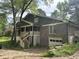 Charming home featuring a brick facade, second-story porch, stairs, and two-car garage at 2256 Mack Rd, Douglasville, GA 30135