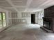 Spacious living room with a brick fireplace, large windows, and ample natural light at 2256 Mack Rd, Douglasville, GA 30135