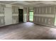 Living room with hardwood floors, fresh drywall, and natural light at 2256 Mack Rd, Douglasville, GA 30135