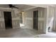 Living room with open floorplan, new walls, and doorway to another room at 2256 Mack Rd, Douglasville, GA 30135