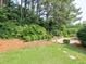 Landscaped backyard with a stone pathway and lush greenery creates a peaceful retreat at 2308 Littlebrooke Dr, Dunwoody, GA 30338