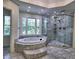 Bathroom with jetted tub and walk-in glass shower at 2308 Littlebrooke Dr, Dunwoody, GA 30338