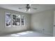 Bright bedroom features natural light from a large window and neutral carpeting at 2308 Littlebrooke Dr, Dunwoody, GA 30338