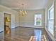 Bright dining room with hardwood floors and elegant chandelier at 2308 Littlebrooke Dr, Dunwoody, GA 30338
