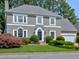 Charming gray two-story home with well-manicured lawn and mature landscaping at 2308 Littlebrooke Dr, Dunwoody, GA 30338