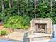 Outdoor stone fireplace on the backyard patio at 2308 Littlebrooke Dr, Dunwoody, GA 30338