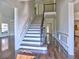 Spacious foyer with staircase, hardwood floors, and wainscoting at 2308 Littlebrooke Dr, Dunwoody, GA 30338