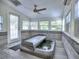 Bright hot tub room with tile floor, ceiling fan, and several windows at 2308 Littlebrooke Dr, Dunwoody, GA 30338