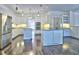 Spacious kitchen with white cabinetry, stainless steel refrigerator, and hardwood flooring at 2308 Littlebrooke Dr, Dunwoody, GA 30338