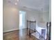 Upstairs landing with view of staircase and hardwood flooring at 2308 Littlebrooke Dr, Dunwoody, GA 30338