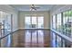Light-filled living room with hardwood floors and large windows at 2308 Littlebrooke Dr, Dunwoody, GA 30338