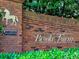 The sign for Brooke Farm is in brick with mature landscaping at 2308 Littlebrooke Dr, Dunwoody, GA 30338