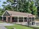 Community pool featuring picnic tables under a covered area perfect for community gatherings and relaxation at 2308 Littlebrooke Dr, Dunwoody, GA 30338