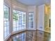Sun-filled sitting area with hardwood floors, large windows, and view of outdoor area at 2308 Littlebrooke Dr, Dunwoody, GA 30338