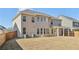 Spacious backyard with a wood fence, offering privacy and ample space for outdoor activities at 1147 Trident Maple Chase, Lawrenceville, GA 30045