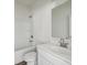 All-white bathroom featuring a shower-tub combo and modern vanity at 1147 Trident Maple Chase, Lawrenceville, GA 30045