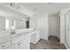 Modern bathroom featuring double vanity, tiled floor, and shower with glass door at 1147 Trident Maple Chase, Lawrenceville, GA 30045