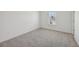 Cozy bedroom features neutral carpet and natural light from the window at 1147 Trident Maple Chase, Lawrenceville, GA 30045