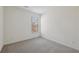This bedroom features neutral carpet and a large window at 1147 Trident Maple Chase, Lawrenceville, GA 30045