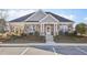 Charming clubhouse with stone accents, a covered porch, and lush landscaping at 1147 Trident Maple Chase, Lawrenceville, GA 30045