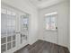 Bright foyer with glass french doors and wood flooring for a modern and elegant look at 1147 Trident Maple Chase, Lawrenceville, GA 30045