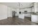Spacious kitchen with stainless steel refrigerator, island, and white cabinetry at 1147 Trident Maple Chase, Lawrenceville, GA 30045