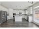 Well-lit kitchen with an island, stainless steel appliances, and hardwood flooring at 1147 Trident Maple Chase, Lawrenceville, GA 30045
