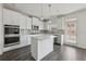Contemporary kitchen featuring stainless appliances, a central island, and modern finishes at 1147 Trident Maple Chase, Lawrenceville, GA 30045