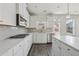 Modern kitchen featuring a gas range, stainless steel appliances, and subway tile backsplash at 1147 Trident Maple Chase, Lawrenceville, GA 30045