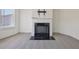 Comfortable living room with fireplace, and large windows at 1147 Trident Maple Chase, Lawrenceville, GA 30045