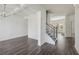 Inviting living room with an open staircase and hardwood flooring at 1147 Trident Maple Chase, Lawrenceville, GA 30045
