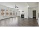 Spacious living room featuring hardwood floors, ample windows, and a cozy fireplace at 1147 Trident Maple Chase, Lawrenceville, GA 30045