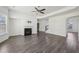 Open-concept living area with hardwood floors, fireplace, and natural light at 1147 Trident Maple Chase, Lawrenceville, GA 30045