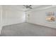 Spacious main bedroom boasts neutral carpet and tray ceilings at 1147 Trident Maple Chase, Lawrenceville, GA 30045