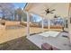 Covered patio with ceiling fans, offering a comfortable outdoor living space with a backyard view at 1147 Trident Maple Chase, Lawrenceville, GA 30045