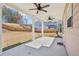 Covered patio with ceiling fans offering a shady retreat and backyard view at 1147 Trident Maple Chase, Lawrenceville, GA 30045