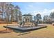 Outdoor playground with slides and climbing structure in a well-maintained community park setting at 1147 Trident Maple Chase, Lawrenceville, GA 30045