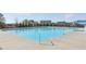 A large community pool with a clear blue water, perfect for swimming and relaxation at 1147 Trident Maple Chase, Lawrenceville, GA 30045