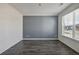 Comfortable room with hardwood floors and a large window at 1147 Trident Maple Chase, Lawrenceville, GA 30045