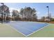 Well-maintained tennis court with clear boundaries, ideal for sports and recreation at 1147 Trident Maple Chase, Lawrenceville, GA 30045