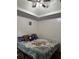 Bedroom with ceiling fan, bed, pillows and floral comforter at 133 Titan Rd, Stockbridge, GA 30281