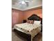 Bedroom with a king-sized bed, unique bedding, carpet flooring, and neutral wall color at 133 Titan Rd, Stockbridge, GA 30281