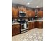 Well-equipped kitchen featuring stainless steel appliances, granite countertops, and ample cabinet space at 133 Titan Rd, Stockbridge, GA 30281