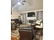 Spacious living room featuring a marble fireplace, plush seating, and large flat-screen TV at 133 Titan Rd, Stockbridge, GA 30281