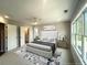 Serene bedroom with large windows, neutral tones, and a comfortable bed with a padded headboard at 1923 Cassia Aly, Kennesaw, GA 30144