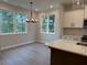 Bright breakfast nook with large windows and modern chandelier lighting fixture at 1923 Cassia Aly, Kennesaw, GA 30144