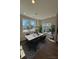 Bright dining area featuring modern chandelier, large windows and stylish black and white rug at 1923 Cassia Aly, Kennesaw, GA 30144